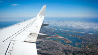 plane flying over san diego