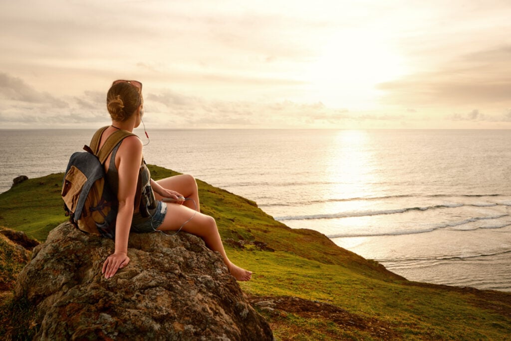 female traveler watching sunset