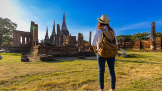 female solo traveler at thai temple