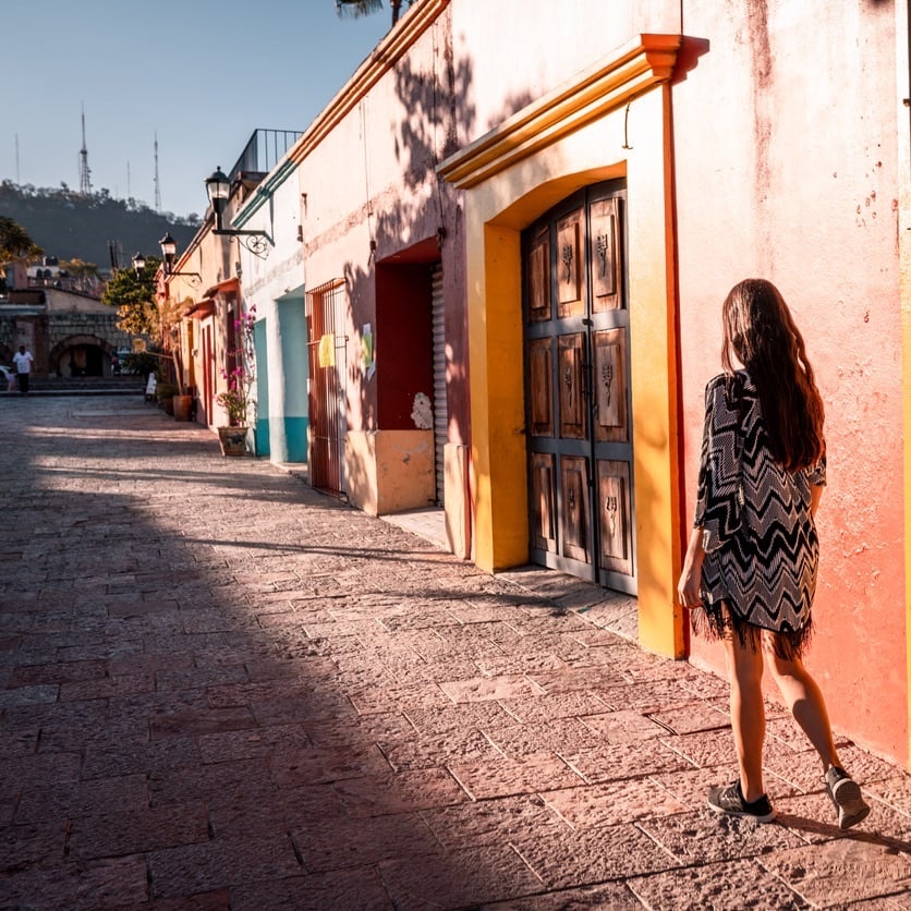 Young woman walking the streets of Oaxaca city