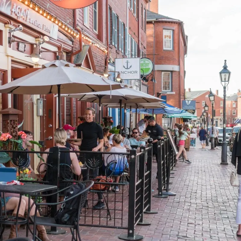 Bustling restaurant patio in Maine.