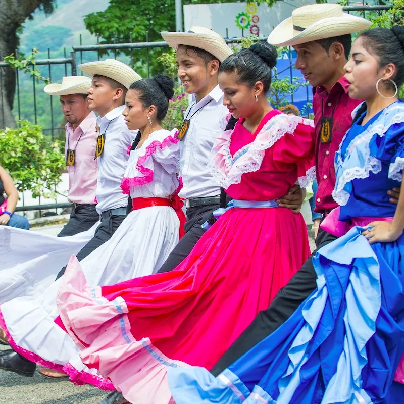 Salvadorian dancers perform during the Flower & Palm Festival in Panchimalco, El Salvador