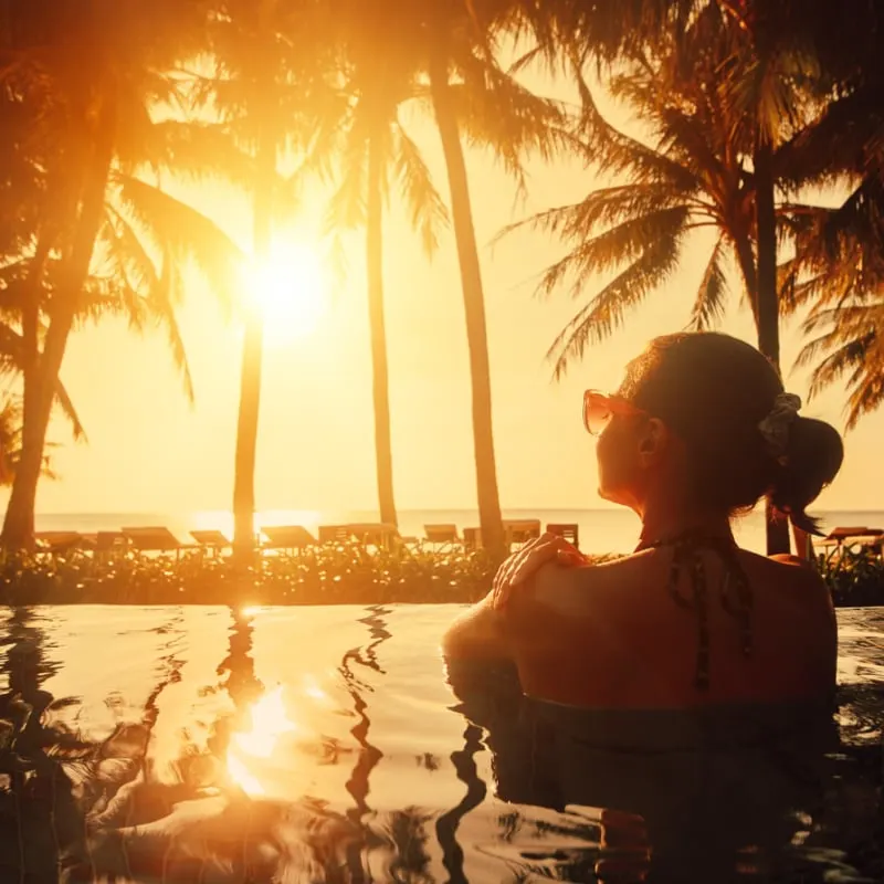 female in pool in tropical location