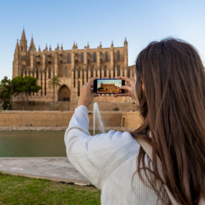 female tourists taking photos in mallorca