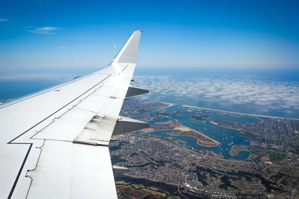 plane flying over san diego