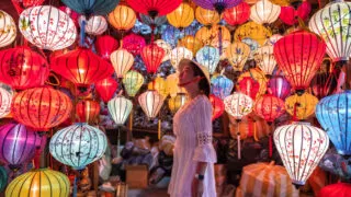 Travel woman choosing lanterns in Hoi An, Vietnam