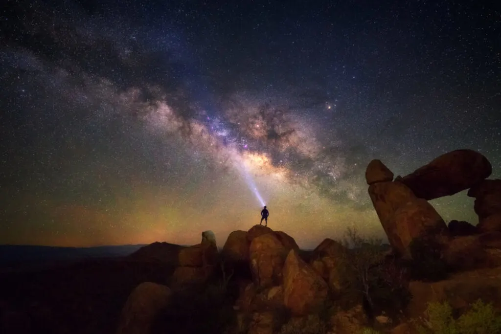 tourist under Milky Way at big bend