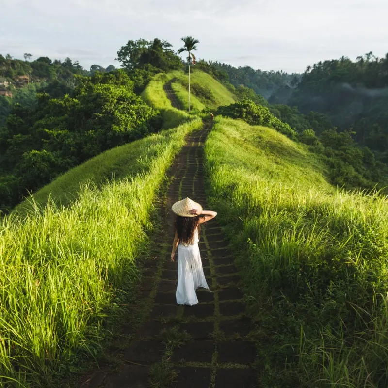 woman walking along the campuhan ridge near ubud in bali indonesia