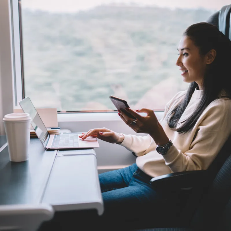woman working on laptop on train